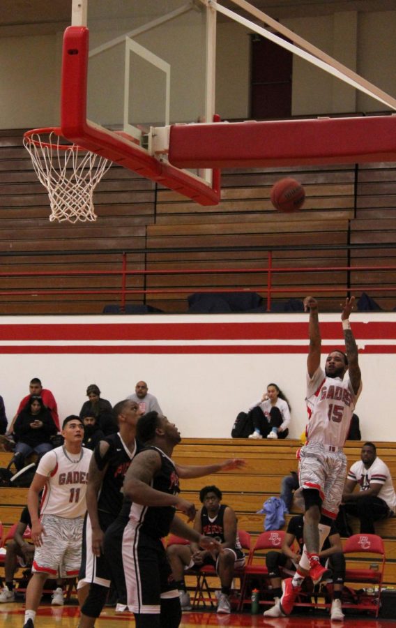 Jamar Hammonds shooting mid-air during the Bakersfield College basketball home game against Los Angeles Pierce College.