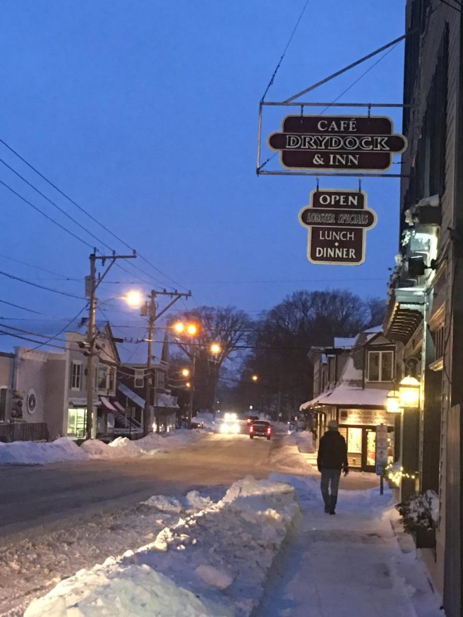 A local resident takes a stroll, at dusk, in the town of Tremont Maine