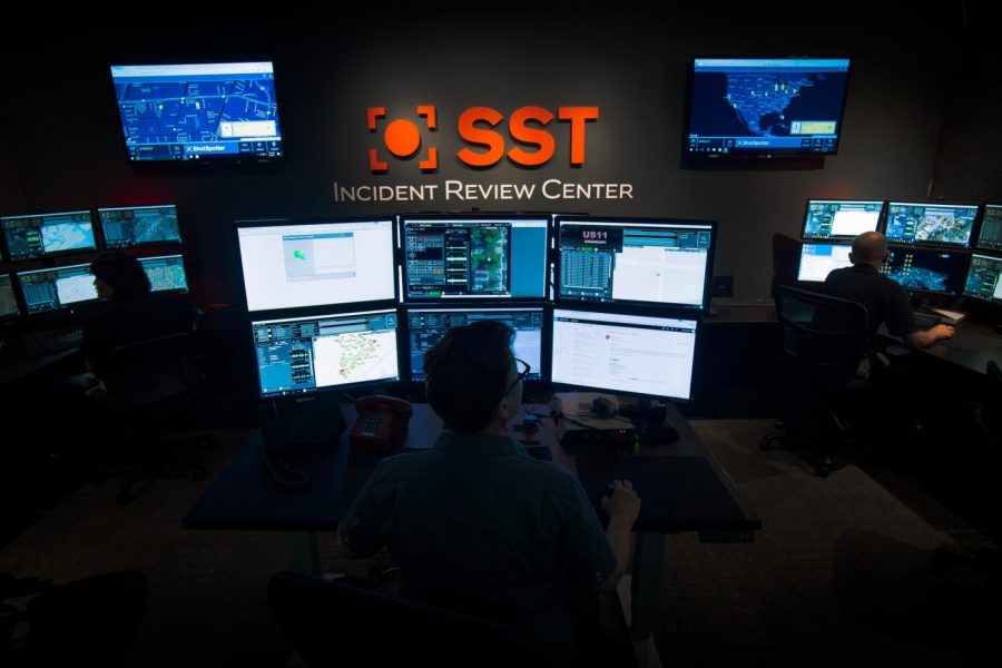 A Shotspotter expert on duty at the SST incident review center, in newark, ca montitoring screens for live gunshots