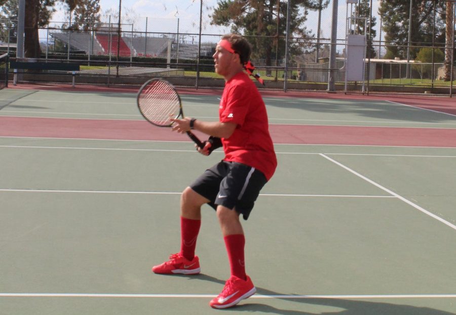 BC player Alec Slykerman waits readily for opponent to serve
