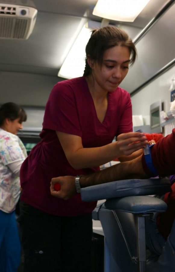 Phlebotomist+Angie+Johnson+in+one+of+the+Houchin+mobile+blood+banks+as+she+preps+a+BC+student+before+drawing+blood%2C+she+was+one+of+many+medical+professionals+at+the+Annual+BC+Blood+Drive+at+Bakersfield+College.+