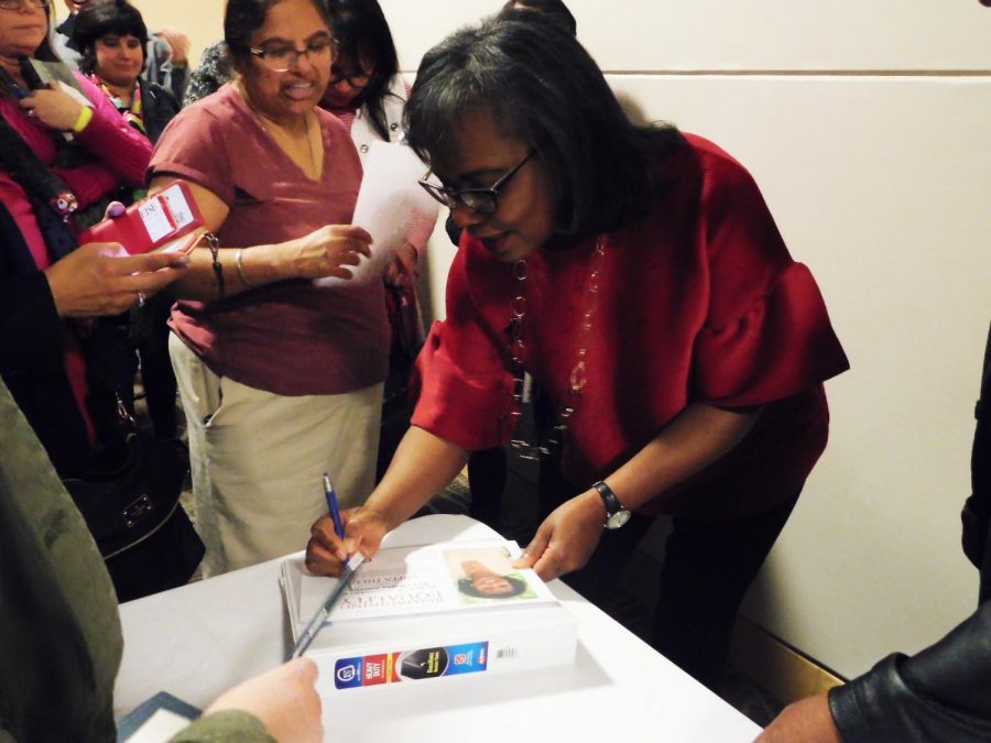 Anita Hill signs books