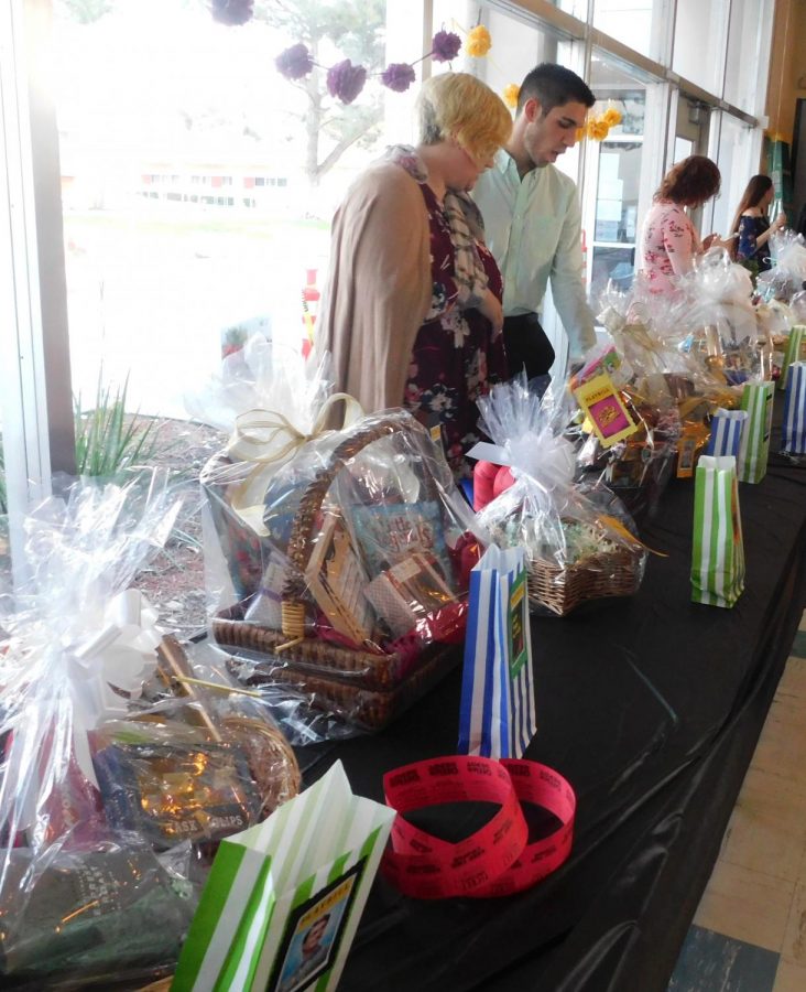 Members of the chamber choir arranging the gifts raffled later that night.