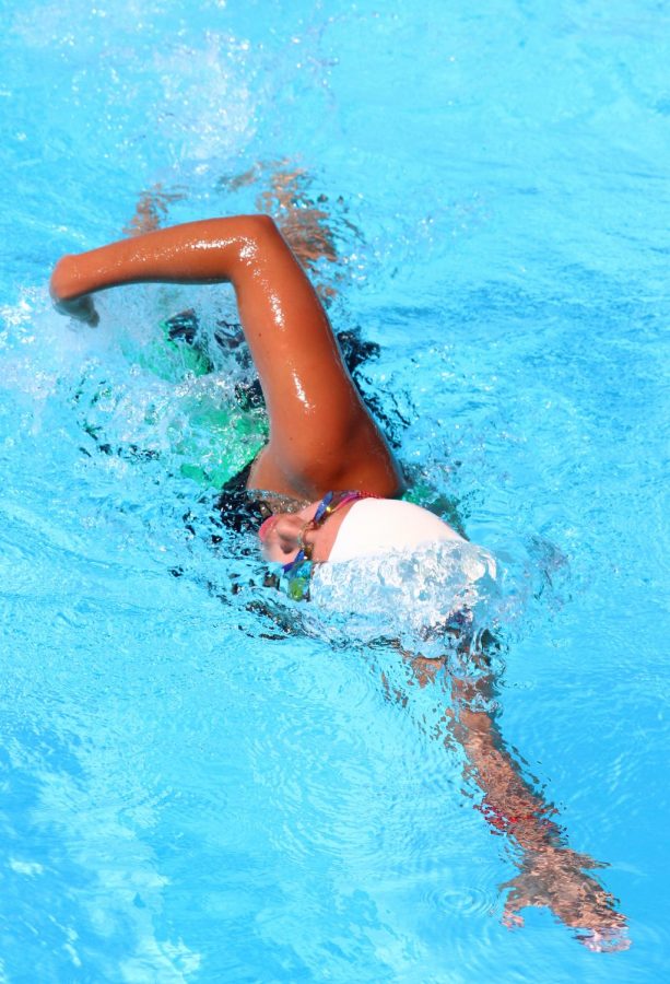 BC womens swim team member competes.