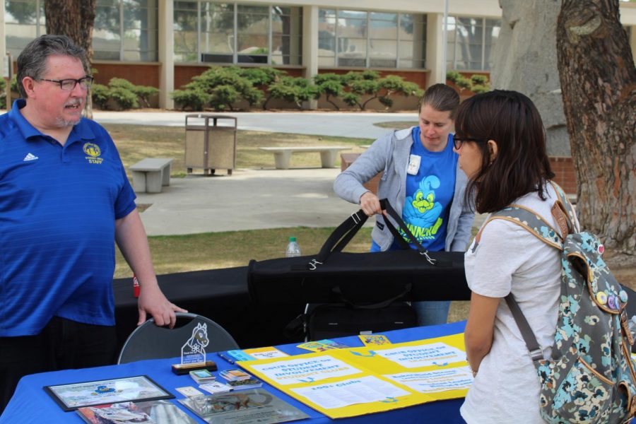 Ed Webb talks to a student about clubs at CSUB.
