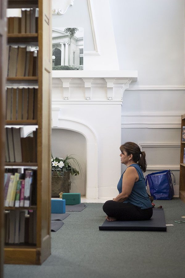 Instructor Linda Guerra ensures little interruption of library function by setting up the class in a quiet corner