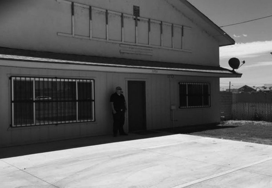 Security guard stands outside the exterior of a local Bakersfield marijuana dispensary.