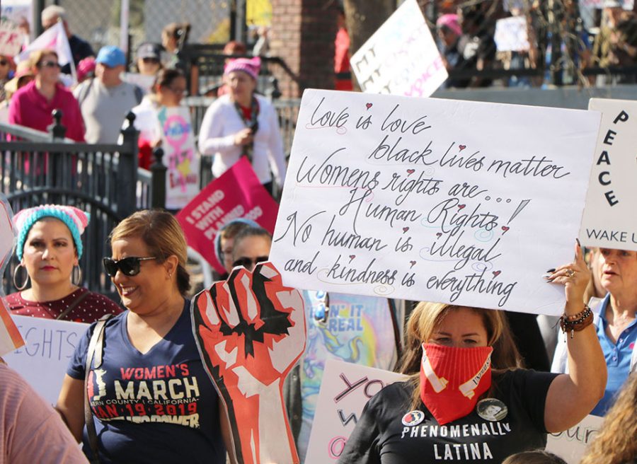 Supporters march through Mill Creek Park during Kern County Women’s March.