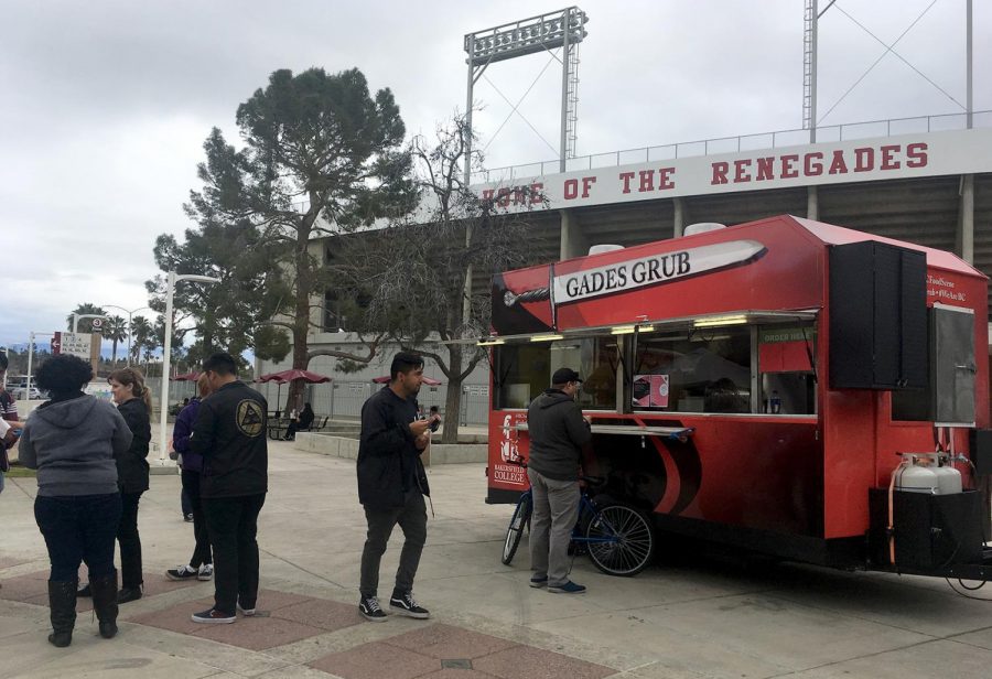 BC students wait for the next round of free samples at the Gades Grub food truck.