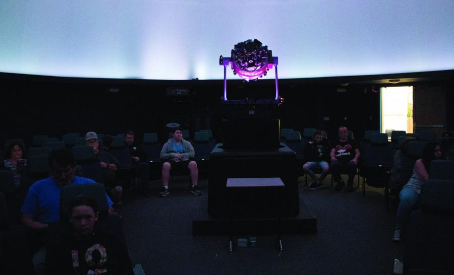Viewers gather for the screening of “Dawn of the Space Age,” at the William M. Thomas Planetarium on March 28.