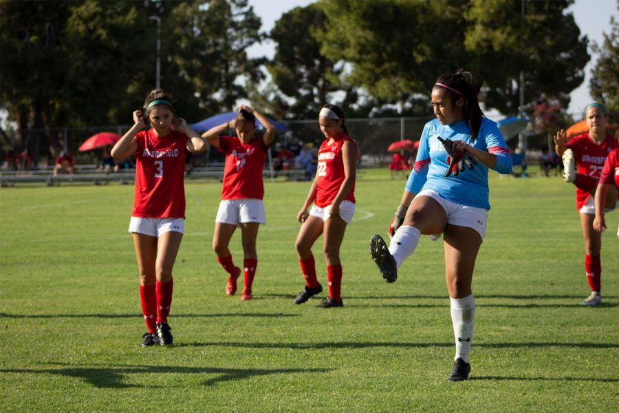 Makenna Ramirez (3), Maya Ornalez (14), Andrea Campos (22) and Aurora Fernandez (1) warming up for the game.