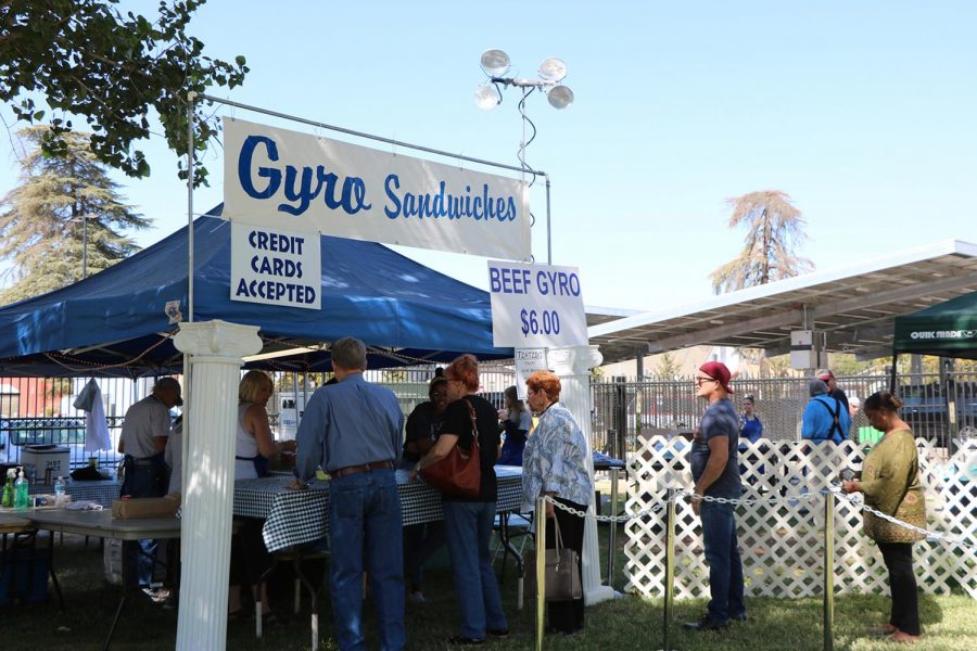 Visitors+of+the+Greek+Food+Festival+waiting+in+line+for+a+Gyro+Sandwich+on+Oct.+5.+