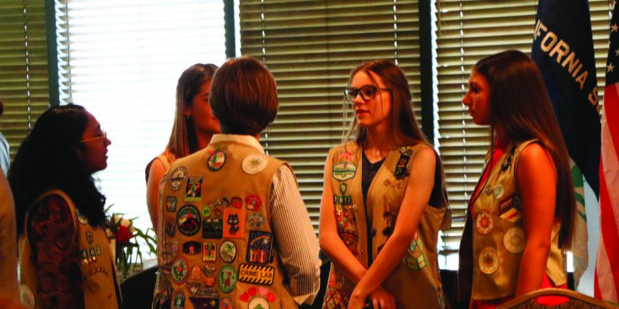 Girl Scouts Callie MCcakley (center), Vaishnari Samudrala (left), Alexsia Drulias (center), Jordan Rasmussen (right), and Cassidy Gereke (far right) are seen discussion their school life and what they love about being a part of Girl Scouts at the Girl Scouts Awards Dinner at Petroleum Club of Bakersfield on Oct. 11