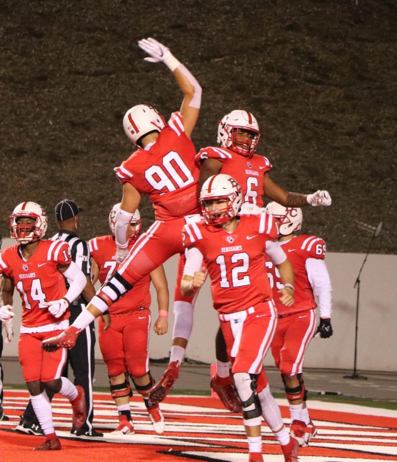 The Bakersfield College football team celebrating Shane Jonas’s 33-yard touchdown in the second quarter during homecoming night at Memorial Stadium, Oct. 19. The Renegades dropped their conference opener to the Ventura College Pirates, 29-21. 