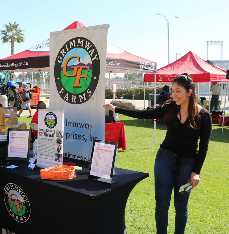 Maria Castro, a former BC student and now an employee at Grimmway Farms, advertising what Grimmway has to offer at the Ag Career Expo on Oct. 23. 