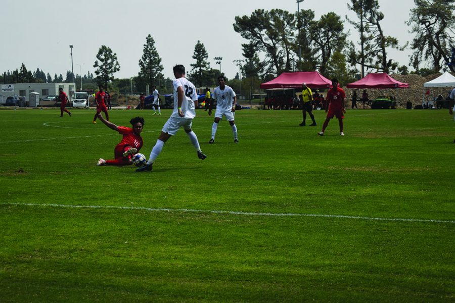 Aug 31 Bakersfield College center midfielder Anthony Miron (10) slides and makes contact with the ball near midfield in the first half.