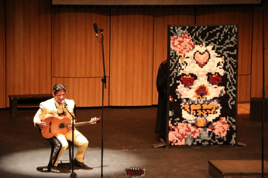 BC student, chamber singer, and member of the Renegade Chorus Mauro Laris performs his solo performance while other student performers complete the tandem art piece created by chamber singer Chrissy Foth.