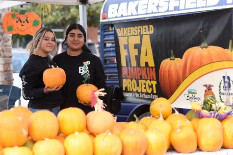Bakersfield High FFA students Lorena Cruz (right), and Rosario Reyes (left) at their Pumpkin Project booth