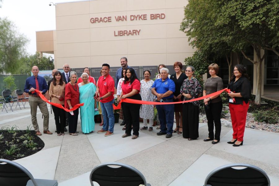 The ceremonial ribbon is cut during the grand opening of The Learning Garden in front of the Grace Van Dyke Bird Library on Oct. 4.