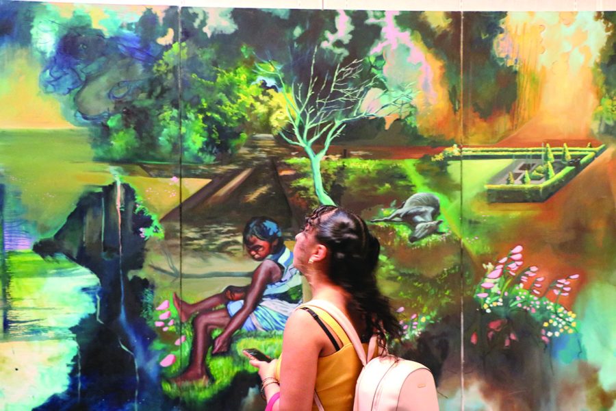 BC student Preet Kamal Kaur looking at Audia Yvonne Dixon’s artwork at exhibit opening on Sept. 8