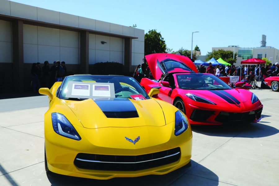 a yellow corvette and a red corvette