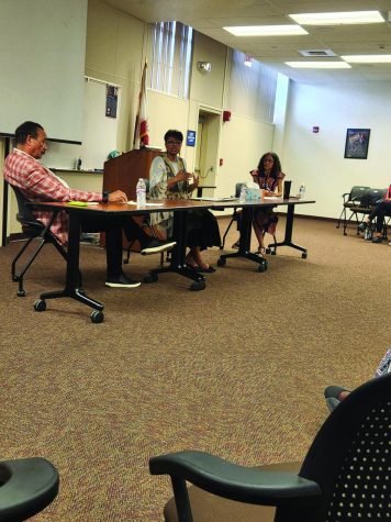 Robert Reader, Jeanie Hill, and Dr. Paula Parks sit at table and talk on Sept .12