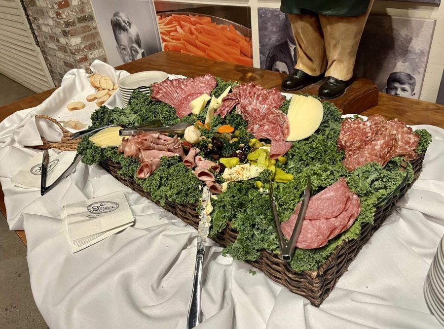 board full of deli meats and cheeses