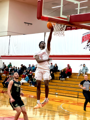 Renegades Guard Sean Fry lays the ball in the net after a fast break opportunity.