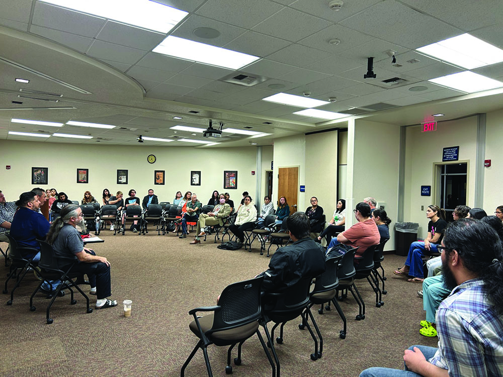 Guests listen to a speaker talk about labor unions at the Renegade Roundtable 