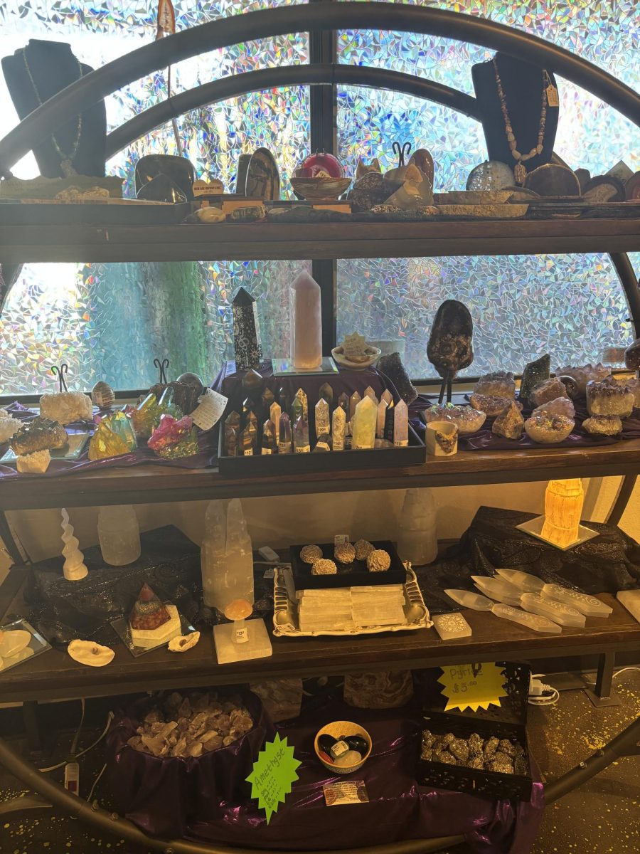 A stand filled with crystal towers and authentic geode slabs.