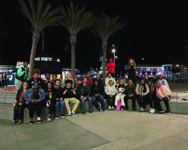Umoja Conference 1- Umoja students, counselors, chaperone, and coordinator posing for a picture down at Fisherman’s Warf. 