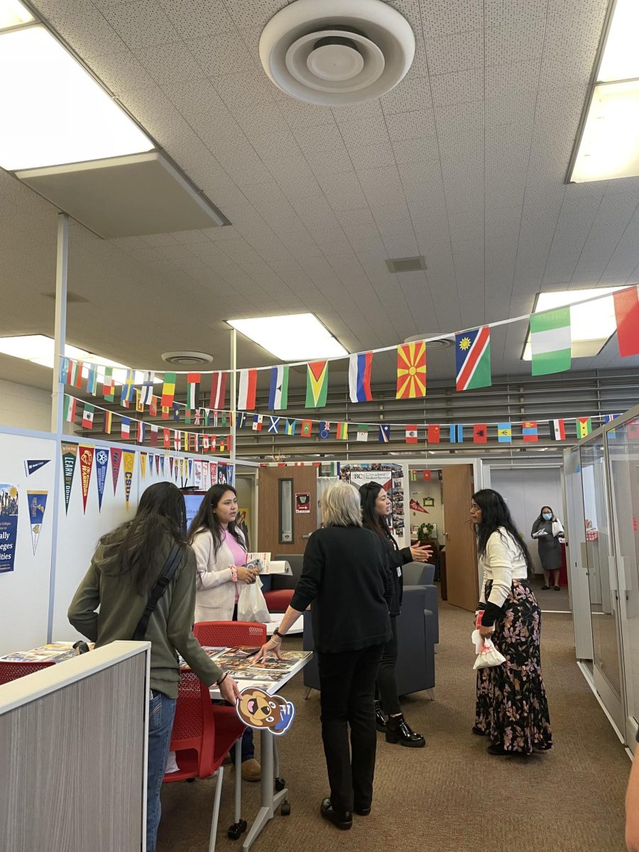 Students and faculty gathered around for Transfer open house.
