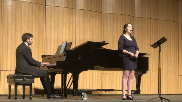 Katie Scaffidi Knudson and John Calanchini performing traditional Sicilian song “Mi votu e mi rivotu” in the Edward Simonsen Theatre on the Bakersfield College main campus.
