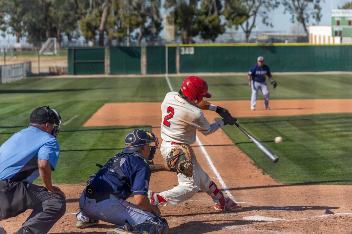 BC outfielder Luis Fuentes swinging during an at-bat vs L.A. Mission.