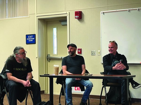 From Left: Williams, Burnham, and Heasley discuss a music piece at Deep Cuts and Conversation session