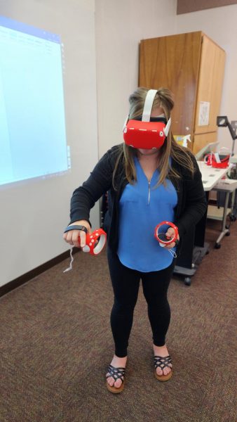 Tanisha Gonzalez Department Assistant III, Career Education (CE) & Strong Workforce using the VR Headsets