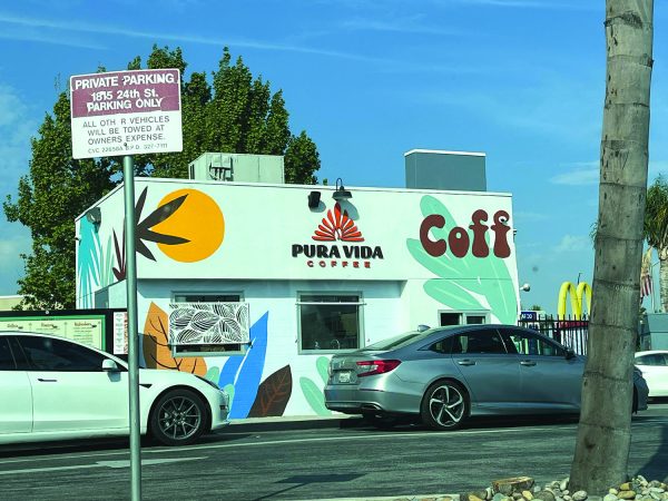 Pura Vida Coffee sits near the intersection of 24th and G streets in the Dunkin’ Donuts parking lot.