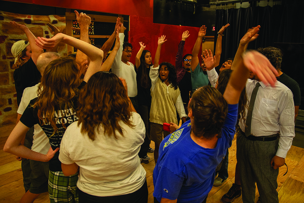 Performers with the Bakersfield College theater celebrate the start of rehearsals for the night for All’s Well That Ends Well at the BC Blackbox, Sept. 24, 2025.
