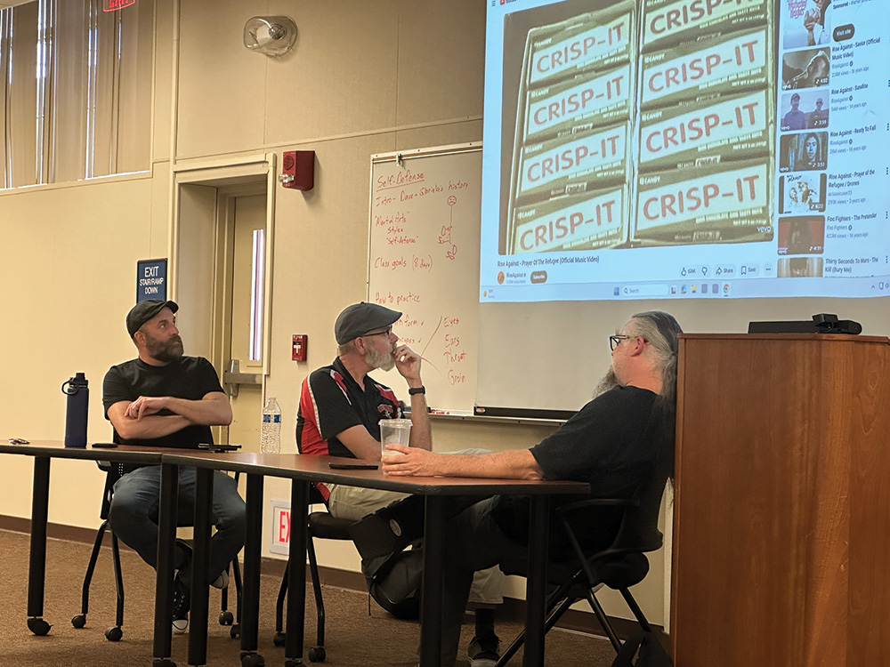 Kyle Burnham, Tim Heasly and Reggie Williams analyzing "Prayer of the Refugee" by Rise Against.